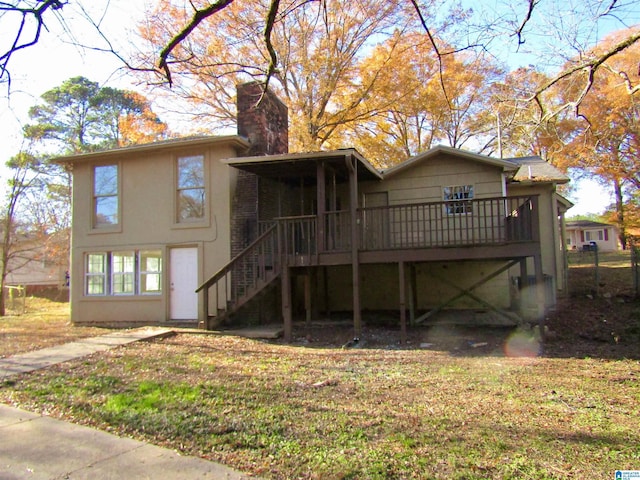 back of house featuring a wooden deck