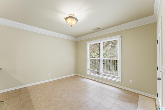 empty room featuring light tile patterned flooring and ornamental molding