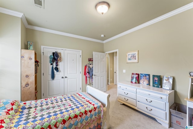 carpeted bedroom with ornamental molding and a closet