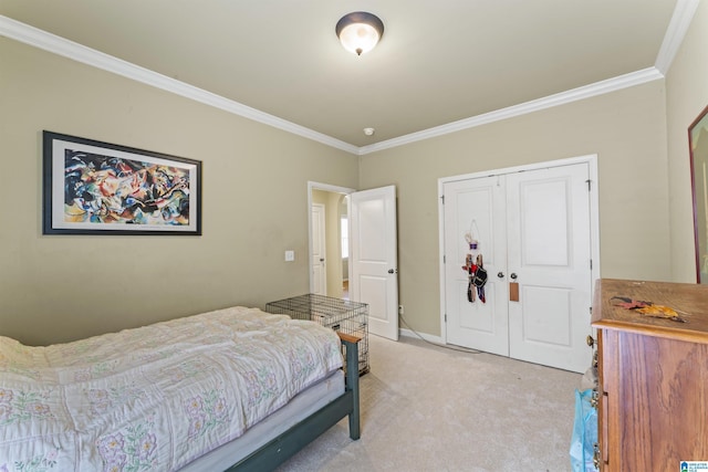 carpeted bedroom featuring a closet and ornamental molding