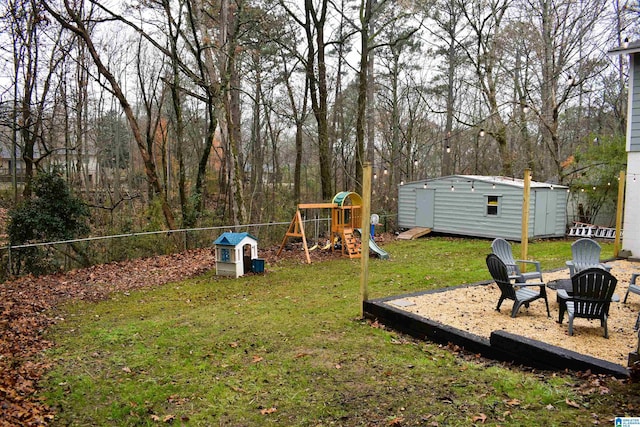 view of yard with an outbuilding and a playground