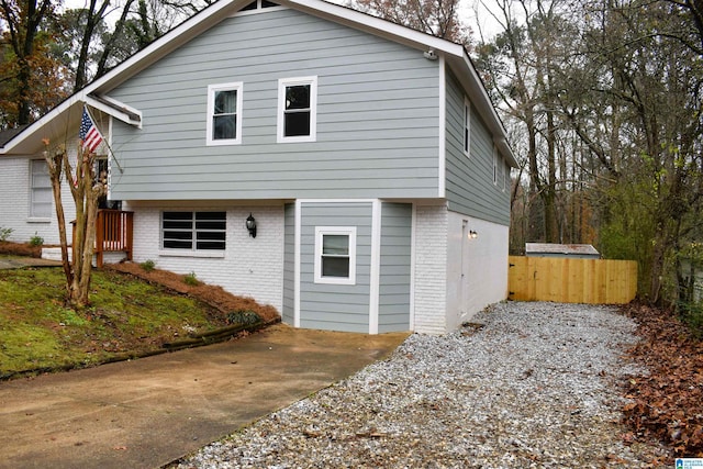 rear view of property with a garage