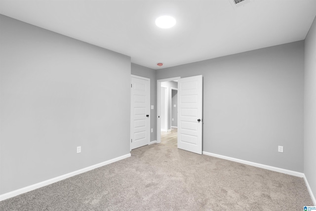 unfurnished bedroom with light carpet