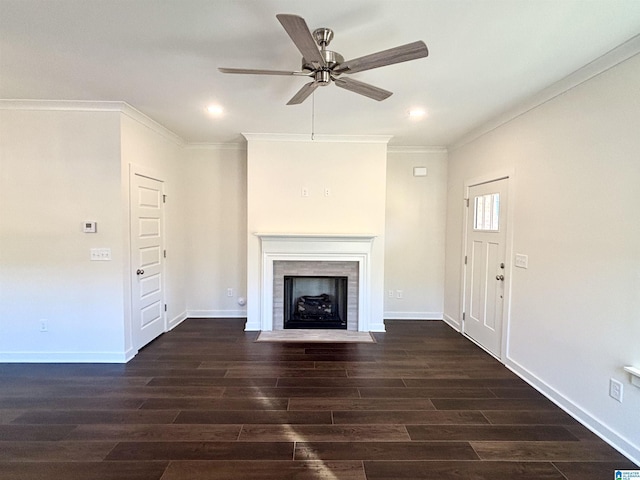 unfurnished living room featuring ceiling fan, crown molding, and dark hardwood / wood-style floors