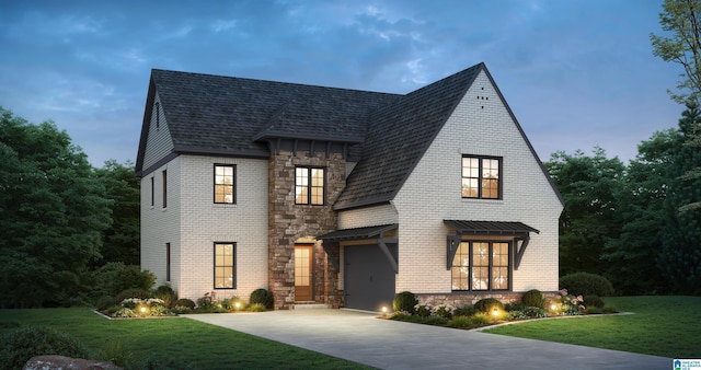 view of front facade featuring a lawn and a garage