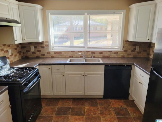 kitchen featuring tasteful backsplash, white cabinetry, sink, and black appliances