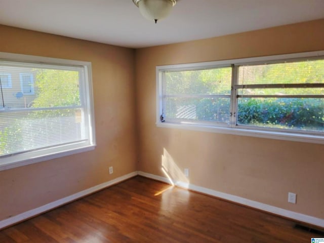 unfurnished room featuring hardwood / wood-style floors