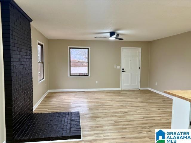 unfurnished room featuring ceiling fan and light hardwood / wood-style flooring