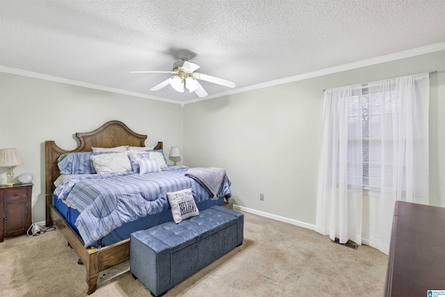 bedroom featuring a textured ceiling, ceiling fan, crown molding, and light carpet