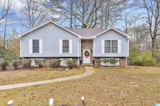 raised ranch featuring a front yard