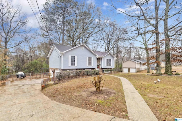 view of front of property with a garage and a front yard