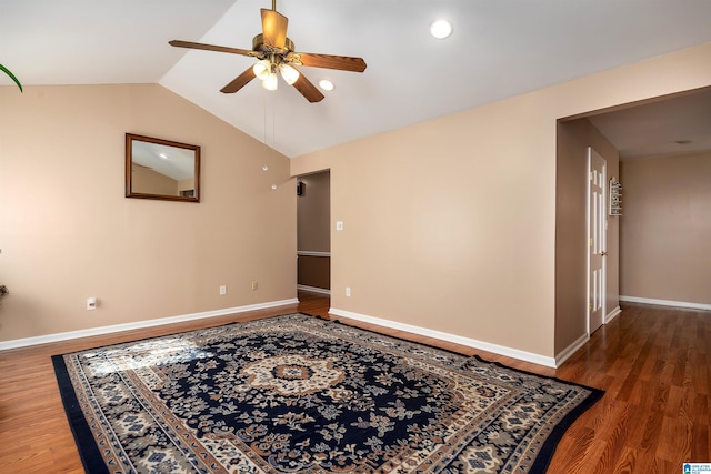 unfurnished room with hardwood / wood-style floors, ceiling fan, and lofted ceiling