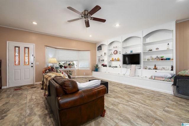 living room featuring ceiling fan and built in shelves