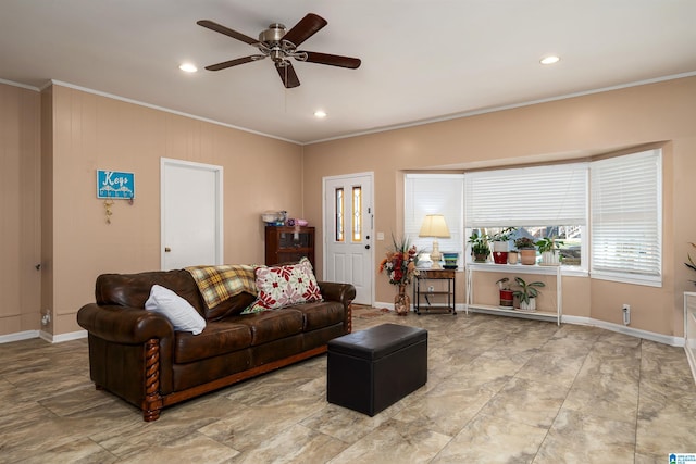 living room featuring ceiling fan and ornamental molding