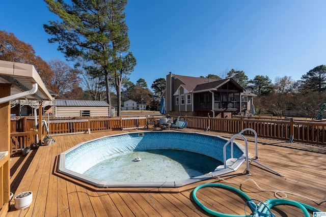 view of pool featuring a wooden deck