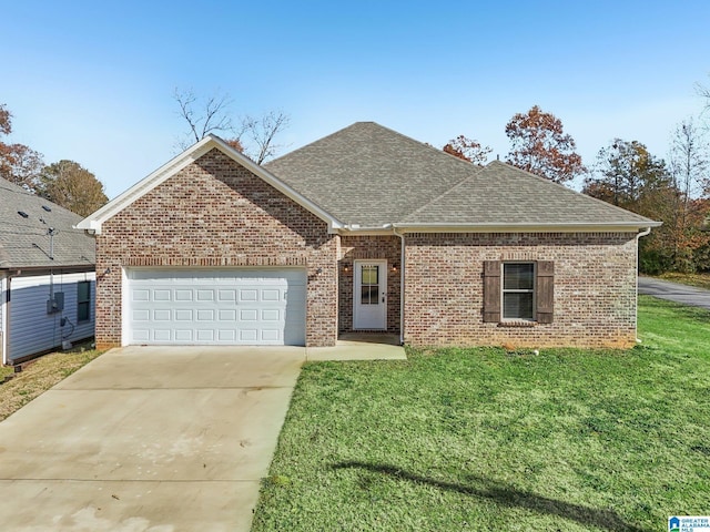 view of front of house with a garage and a front lawn