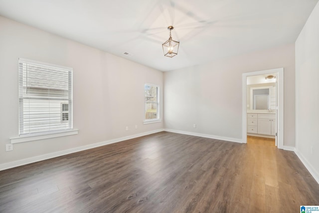 empty room with dark hardwood / wood-style floors