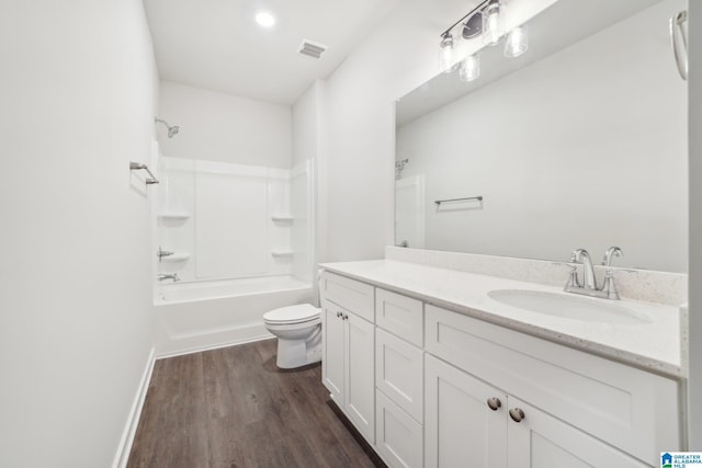 full bathroom with shower / tub combination, toilet, vanity, and hardwood / wood-style flooring