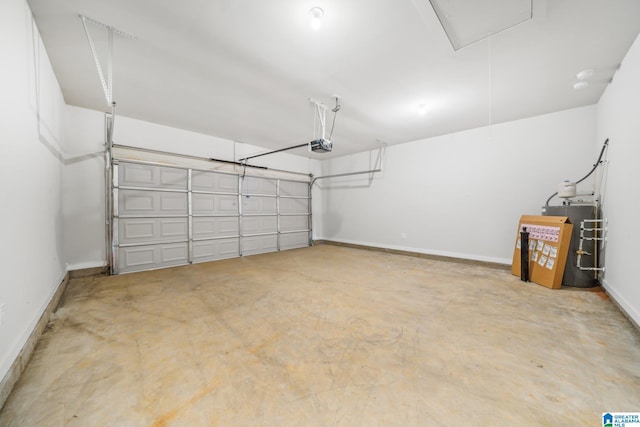 garage with a garage door opener and water heater