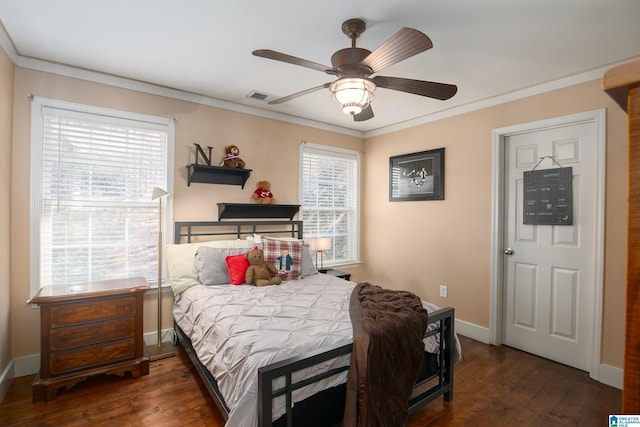 bedroom featuring dark hardwood / wood-style flooring, ceiling fan, and crown molding