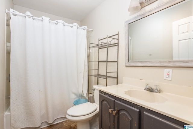 full bathroom with vanity, toilet, and shower / tub combo