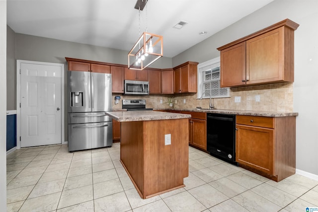 kitchen featuring decorative backsplash, stainless steel appliances, pendant lighting, light tile patterned floors, and a center island