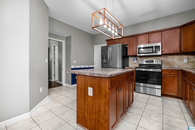 kitchen with a center island, hanging light fixtures, light tile patterned floors, appliances with stainless steel finishes, and tasteful backsplash