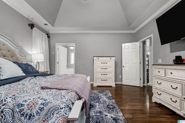 bedroom with lofted ceiling, ensuite bathroom, a raised ceiling, crown molding, and dark hardwood / wood-style floors