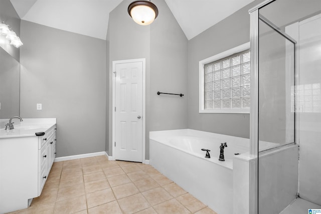 bathroom featuring tile patterned floors, vanity, lofted ceiling, and shower with separate bathtub