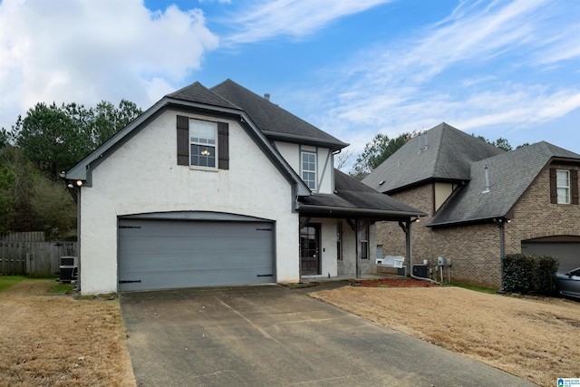 view of front of house with a front yard, a porch, and a garage