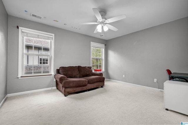 sitting room with light carpet and ceiling fan