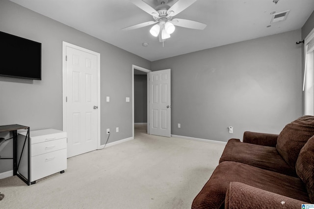 living room featuring ceiling fan and light colored carpet