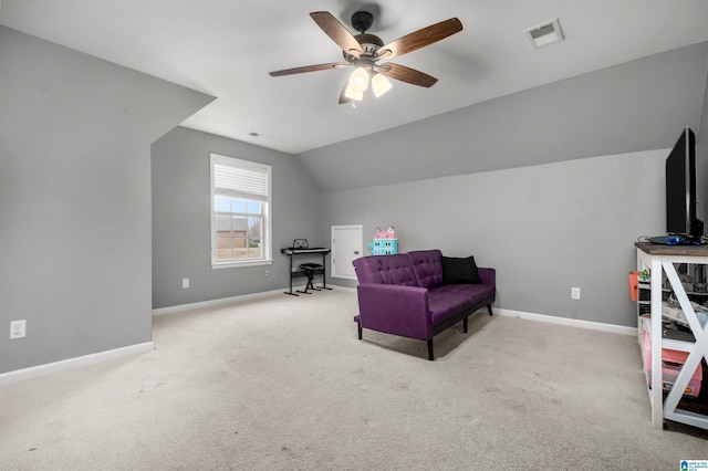 living area with ceiling fan, lofted ceiling, and light carpet