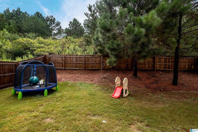 view of yard featuring a trampoline