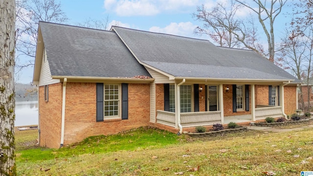 exterior space with a front lawn and covered porch