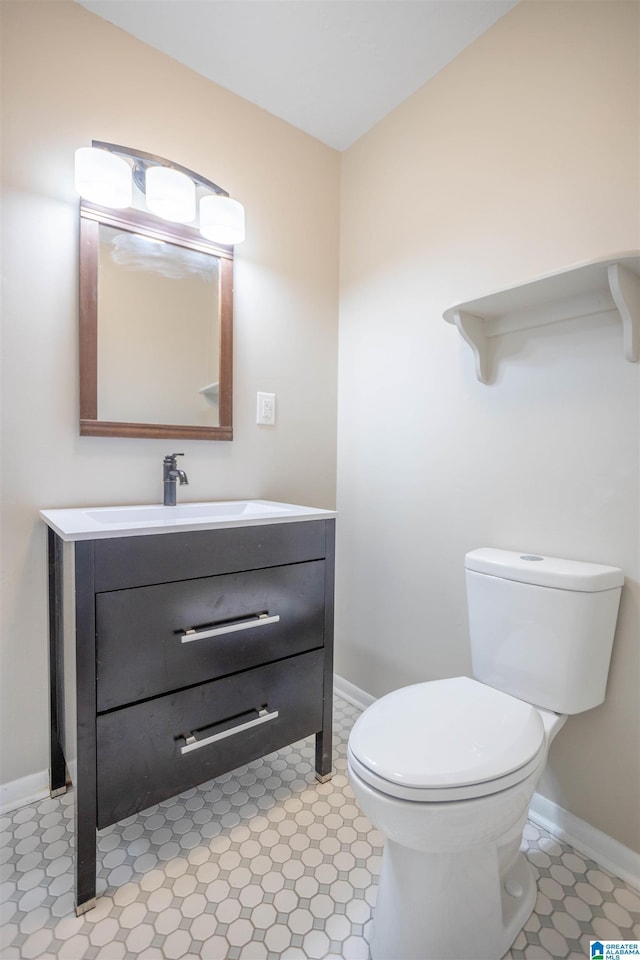 bathroom featuring vanity and toilet