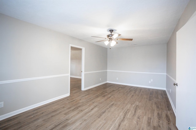 unfurnished room featuring ceiling fan and hardwood / wood-style flooring