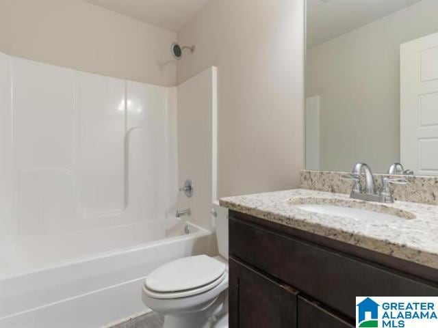 full bathroom with shower / washtub combination, vanity, and toilet