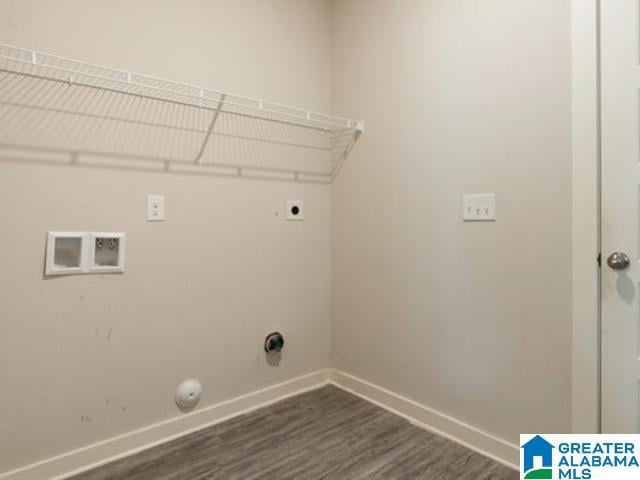 laundry area with hookup for an electric dryer, gas dryer hookup, and dark hardwood / wood-style flooring