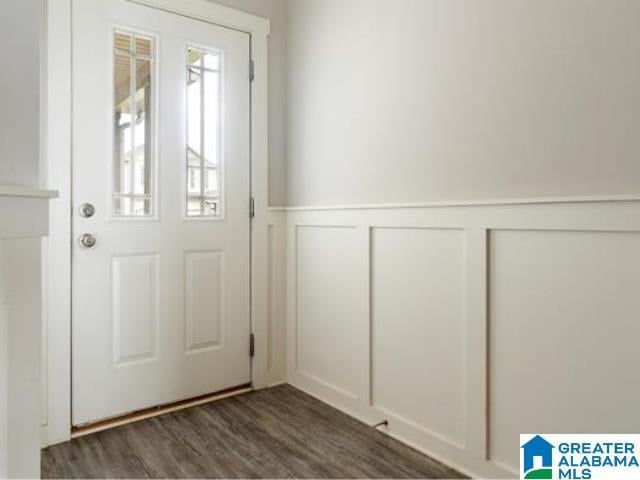 doorway to outside featuring dark wood-type flooring