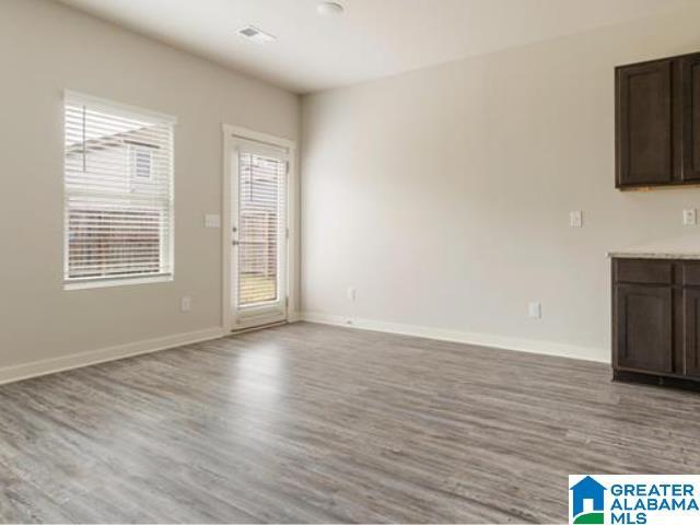 unfurnished living room with light hardwood / wood-style flooring