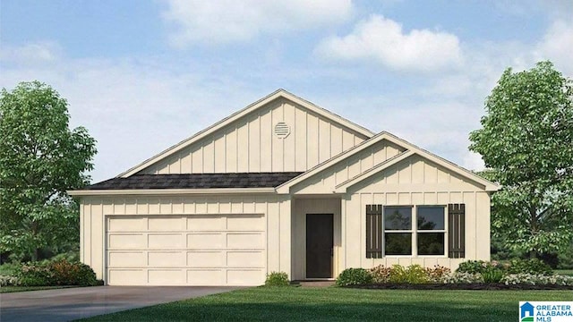 view of front of home with a front yard and a garage