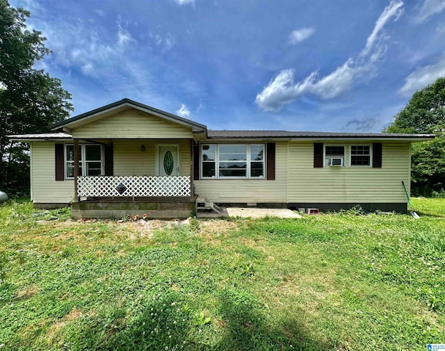 single story home with a porch and a front yard