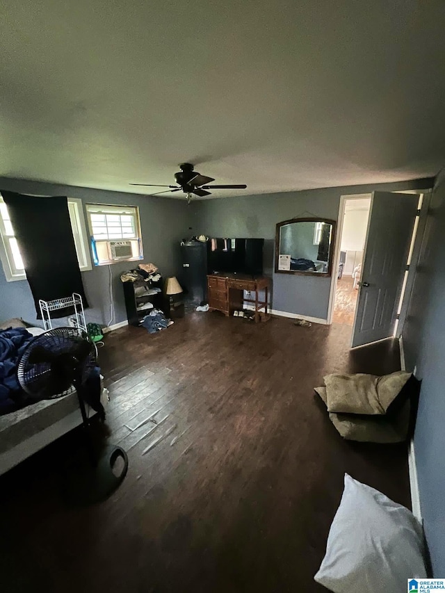 living room with cooling unit, ceiling fan, and dark wood-type flooring