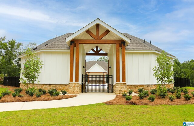 entrance to property with a lawn