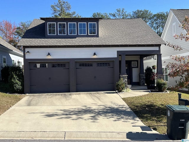 view of front of house with a front lawn and a garage