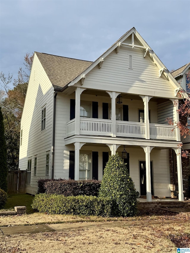 view of front of property with a balcony