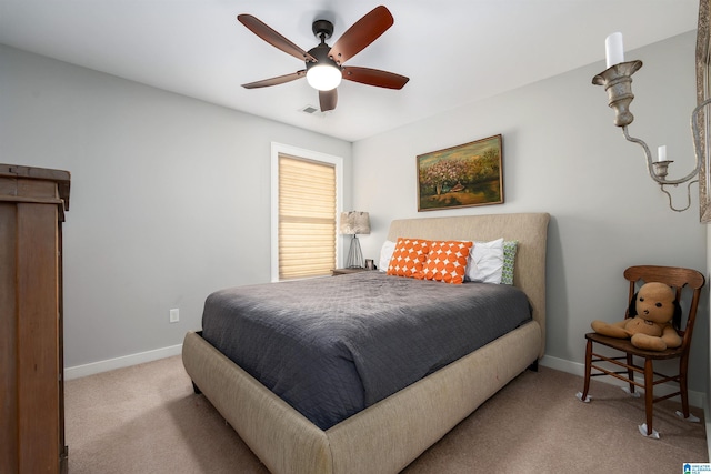 bedroom featuring ceiling fan and light colored carpet