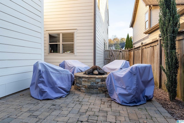 view of patio featuring a fire pit and grilling area