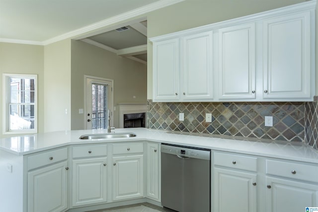 kitchen featuring dishwasher, kitchen peninsula, white cabinets, and sink